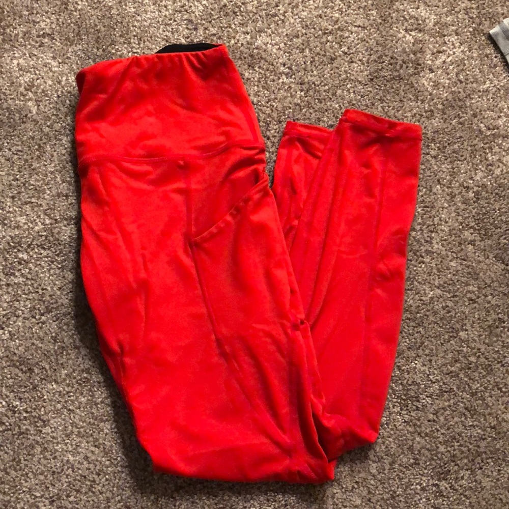 Red, cropped leggings with pockets.